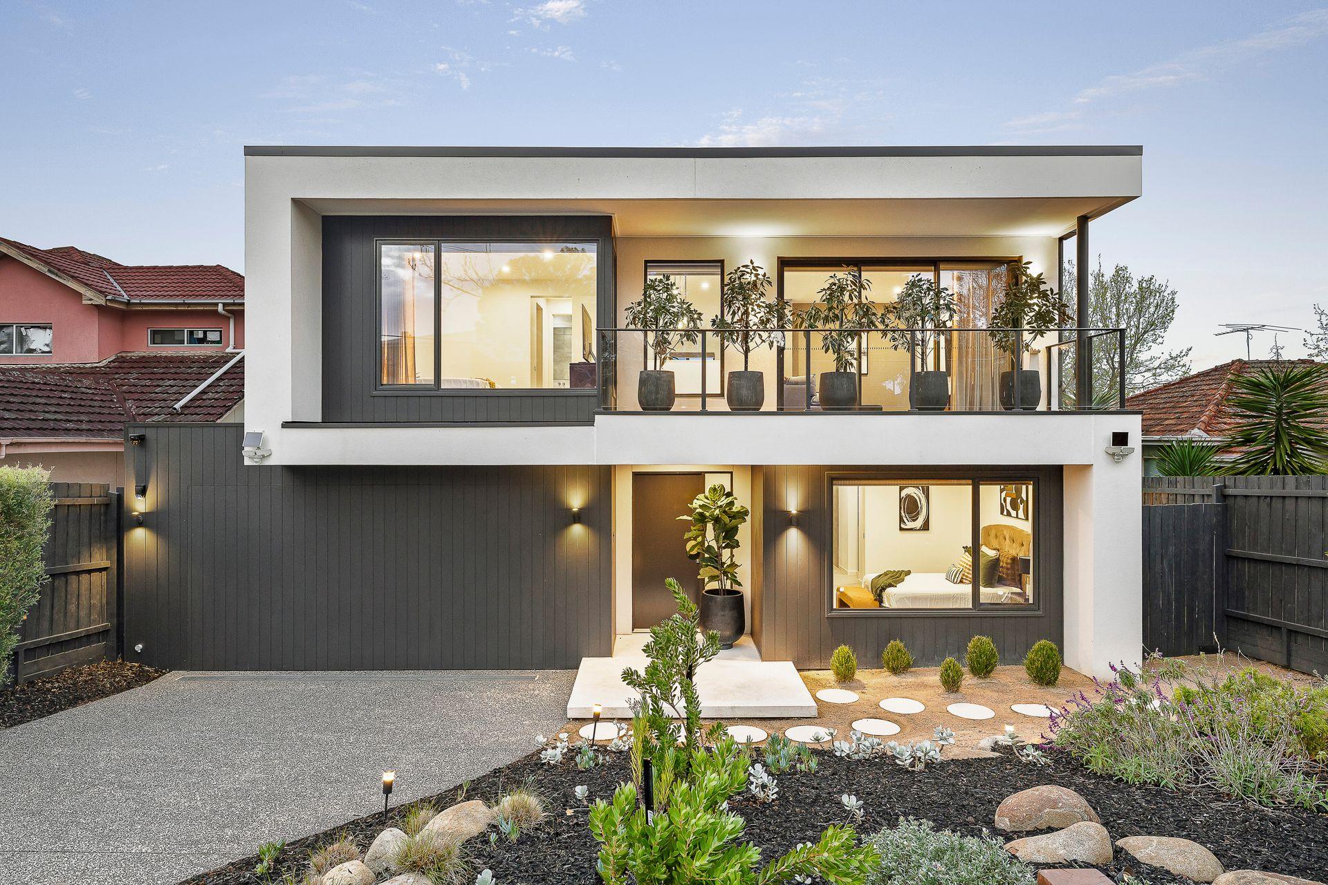 Architectural home at dusk in Melbourne's inner east sold by Pavlou Brothers
