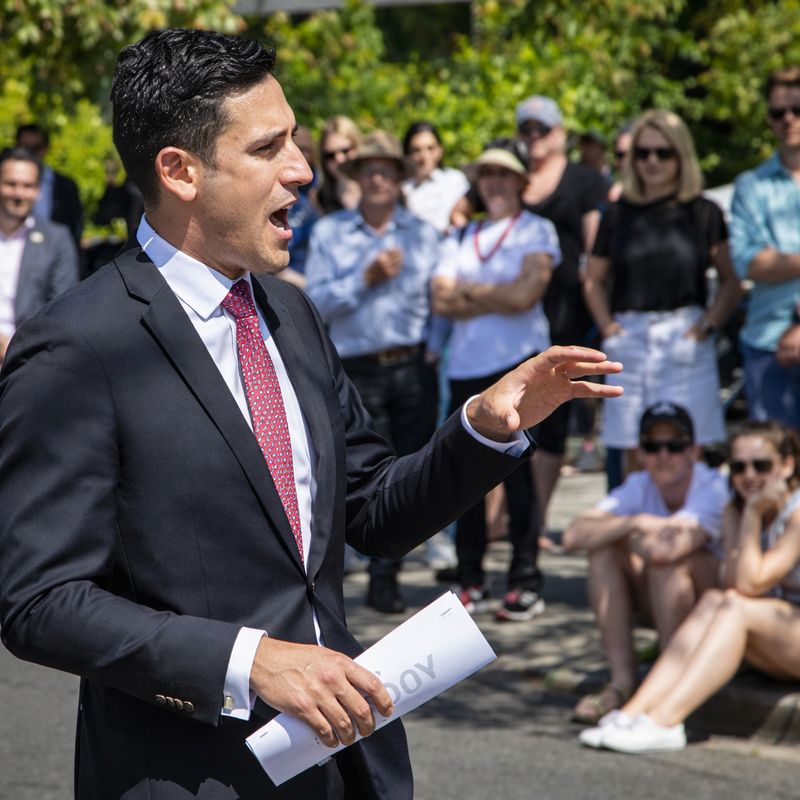 Auction day in Melbourne's inner east Crowd gathered on the nature strip at a Melbourne auction run by Pavlou Brothers