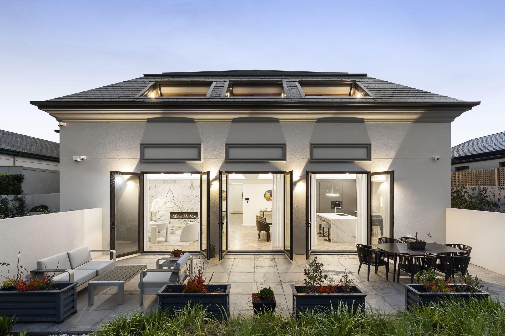 Brand new home delivered on a development site Newly completed contemporary home on a Melbourne development site at dusk