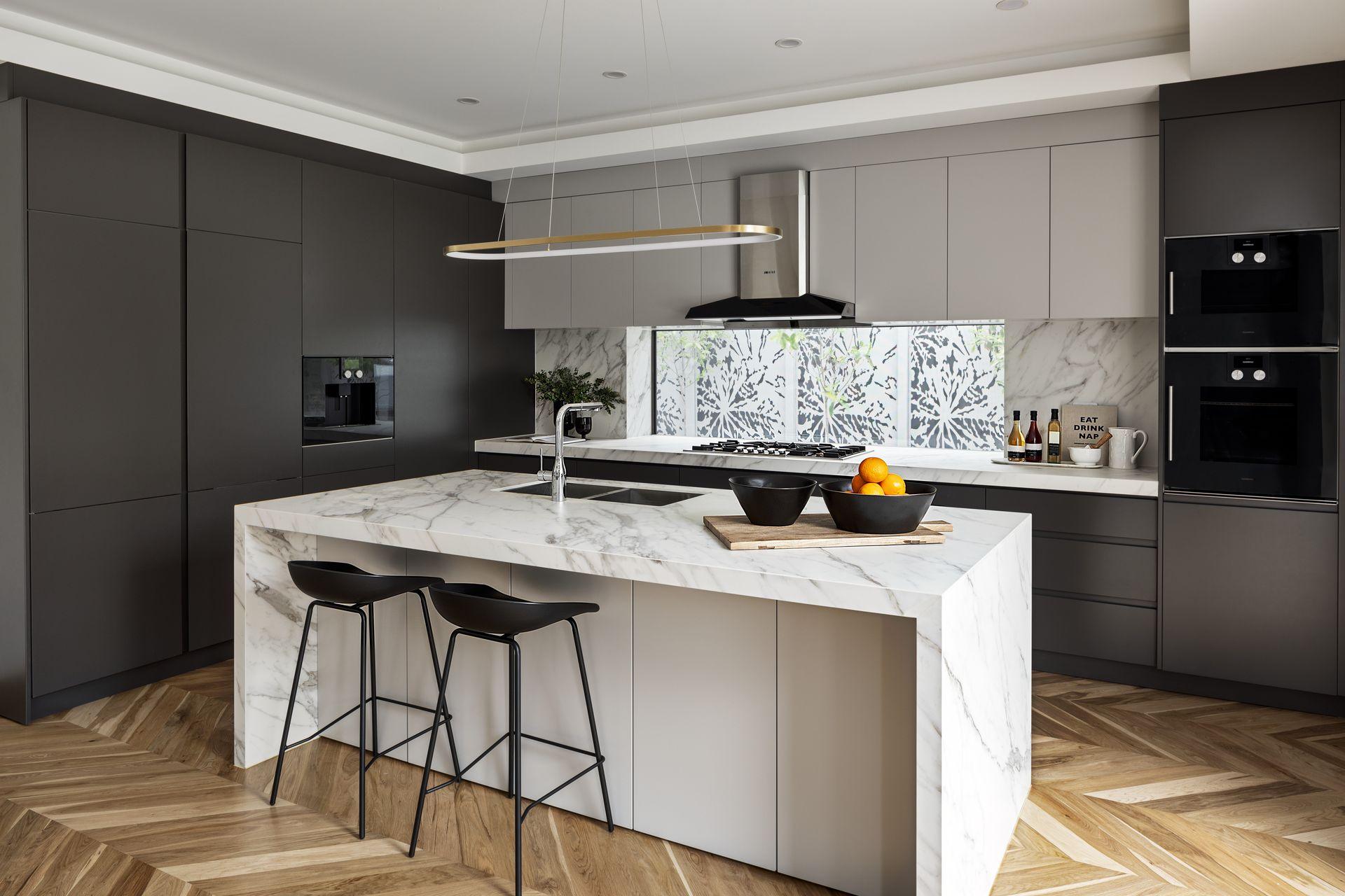 Open plan living and dining room in a luxury Melbourne home sold by Pavlou Brothers